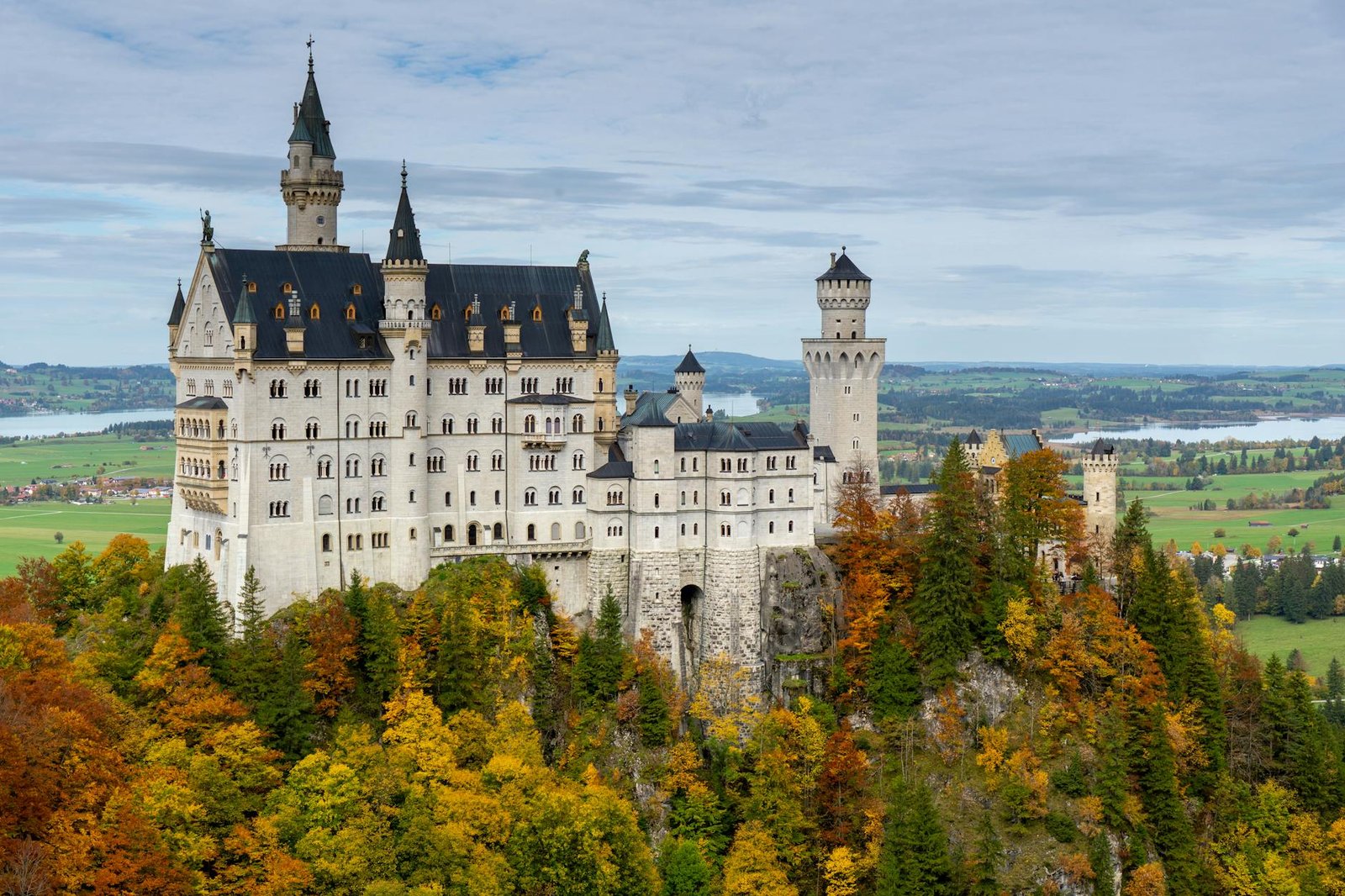 neuschwanstein castle near autumn trees